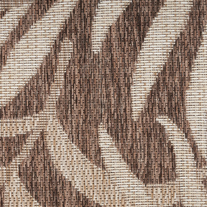 Brown and beige woven fabric with a bold geometric chevron pattern; textured, tweed-like textile for upholstery.