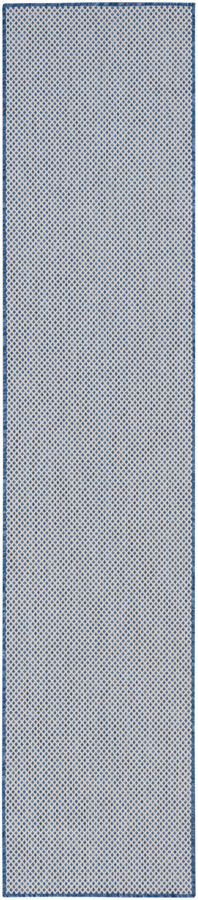 Blue-bordered long runner rug with white diamond lattice on pale blue field.