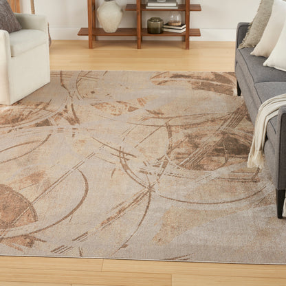 Abstract beige area rug with brown sweeping arc patterns in a bright living room; light wood floor, white & gray sofas.