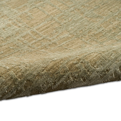 Beige-toned area rug with subtle geometric pattern & plush textured weave; rolled edge visible.