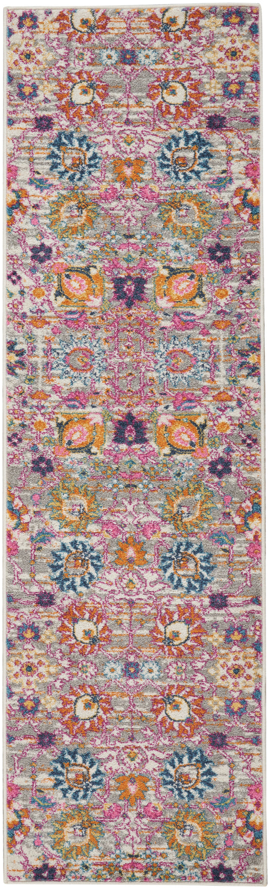 Colorful boho Persian runner rug with pink, orange, yellow, teal and blue floral medallions on a light gray background.