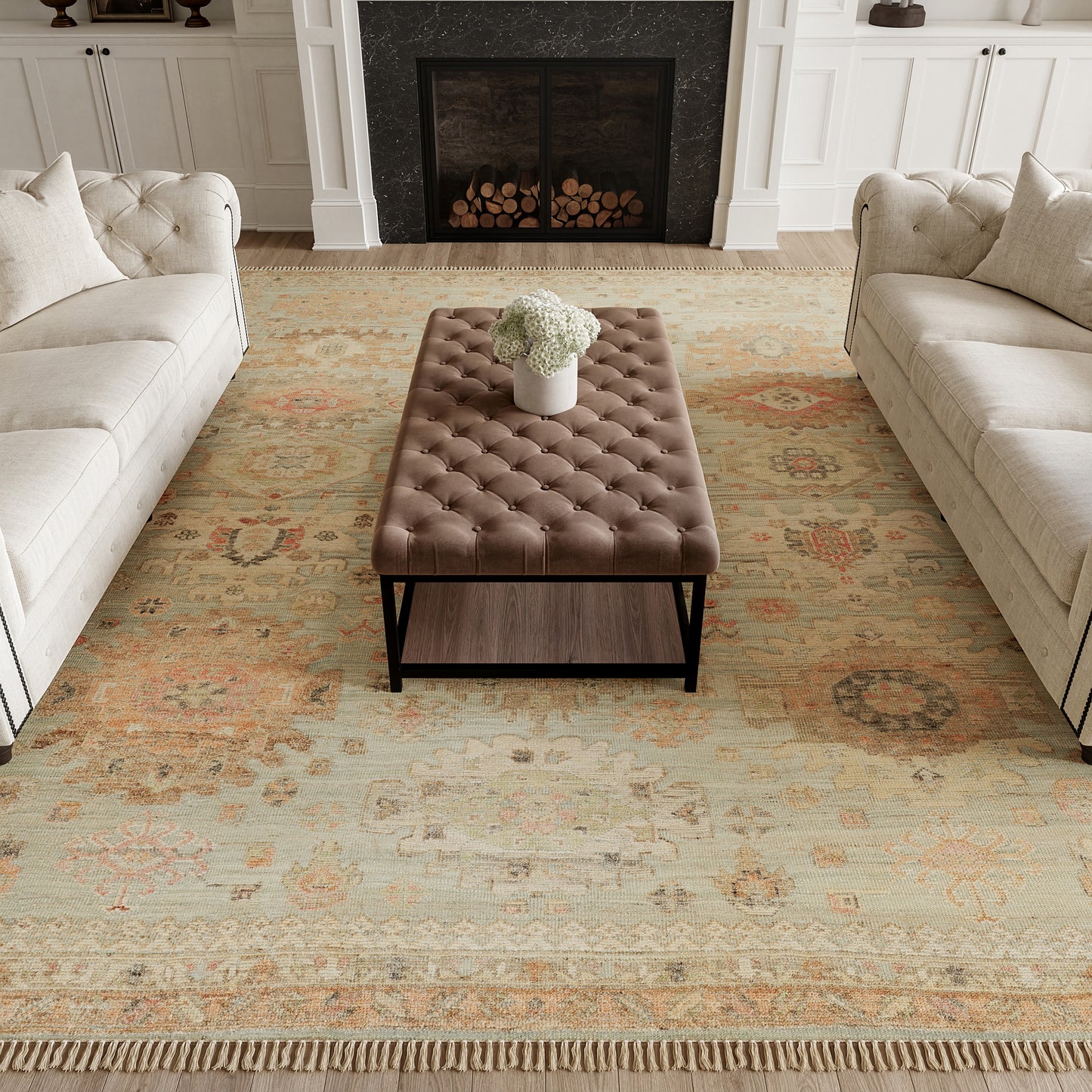 Vintage 9' x 12' beige patterned rug in a living room with cream sofas.