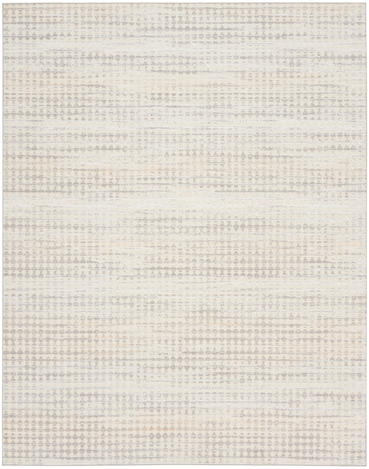 Cream and beige textured rug with tiny dot pattern and soft horizontal bands, rectangular living-room area rug