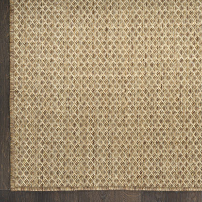 Natural jute runner rug with beige-brown diamond weave and fringed edge, on a dark wood floor, 10 ft long.