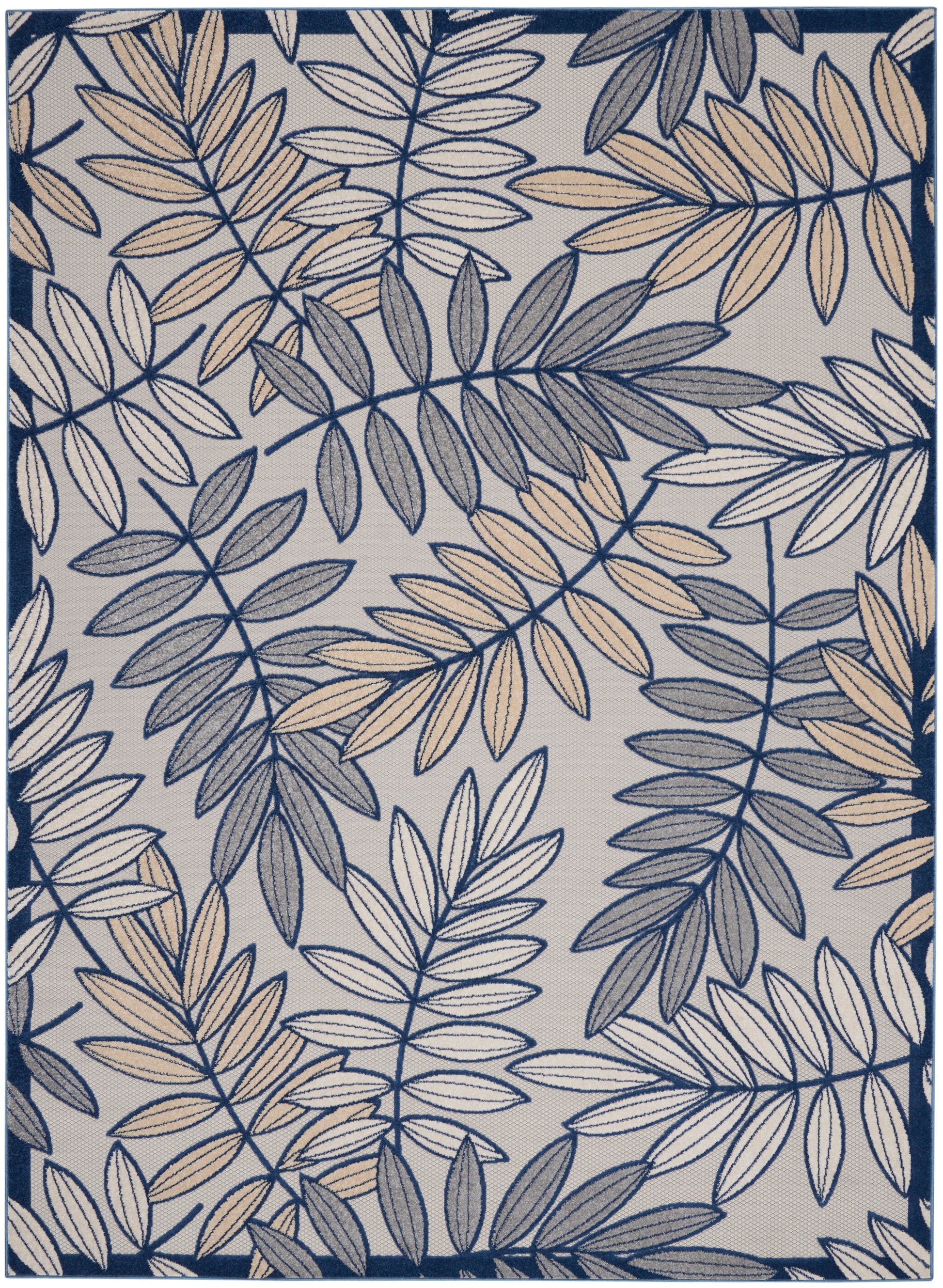 Rectangular area rug with navy and beige fern-like leaf pattern on light gray background, navy border.
