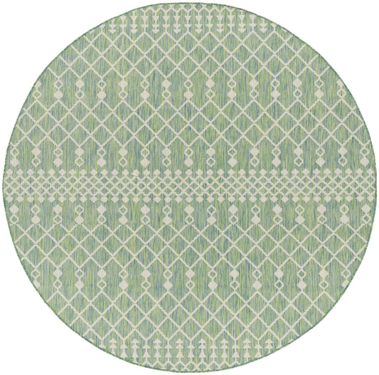Round green rug with white geometric lattice pattern and a pale central band; woven texture.