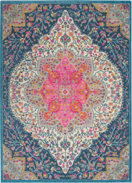 Vibrant oriental rug with a large pink central medallion, teal & navy border, and multicolor floral motifs.