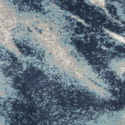 Abstract blue rug with navy, sky blue & beige marbled pattern; plush, soft area rug for living room.