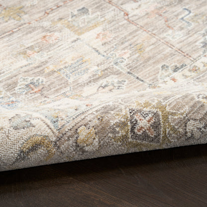 Distressed oriental-style runner rug with a beige base and muted blues, yellows and oranges; rolled edge on dark wood floor.