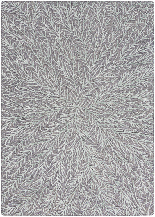Lavender-gray area rug with a white fern-like pattern radiating from the center; soft, textured fibers.