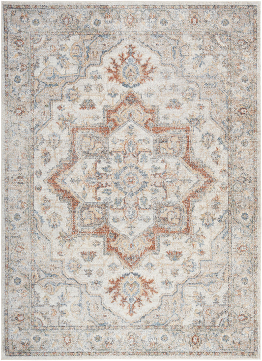 Distressed vintage oriental area rug with ivory, pale blue and rust tones; central medallion and ornate border.