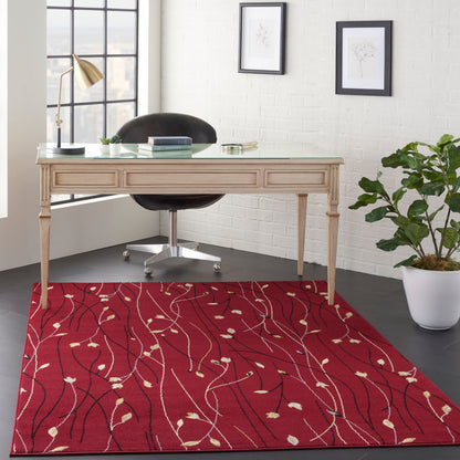 Red rug with white leaf-vine pattern.