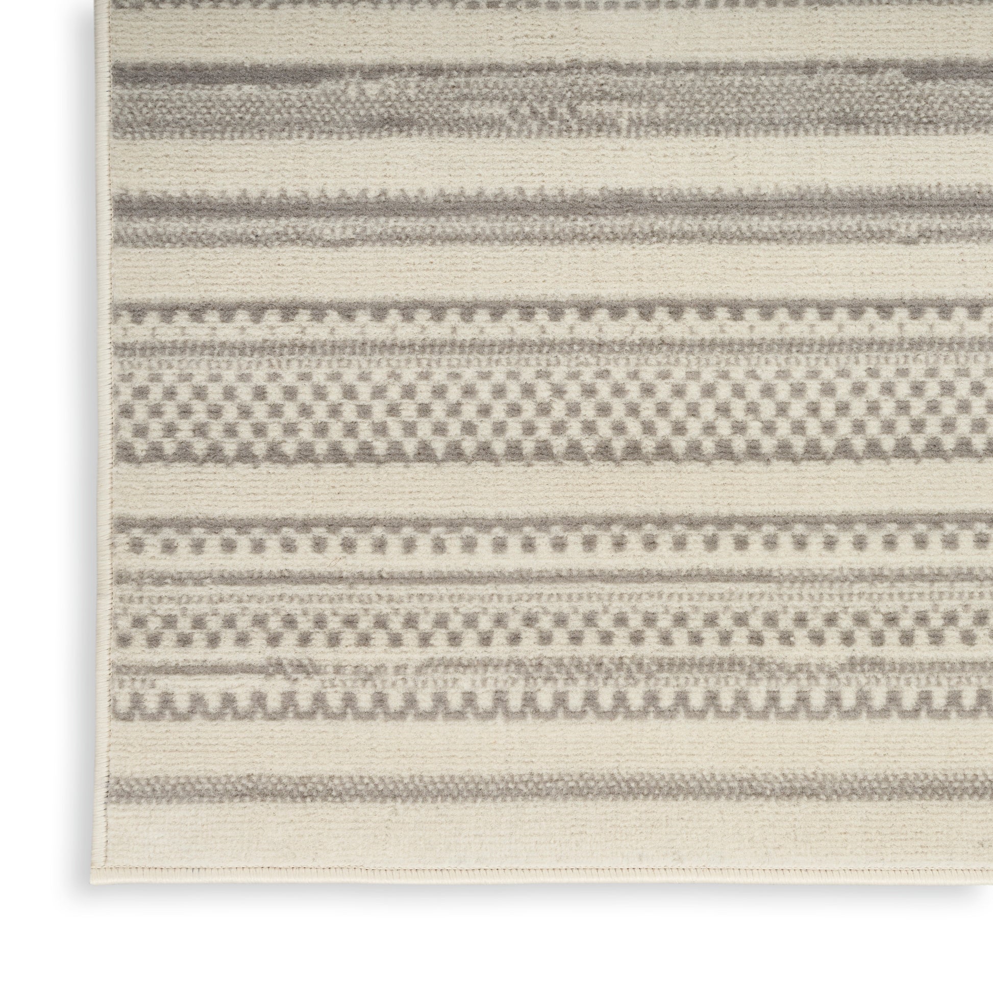 Neutral beige area rug with gray geometric stripes and dotted bands; woven texture for modern, minimalist decor.