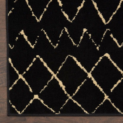 Rectangular black rug with cream geometric diamond lattice, beige lines, bordered in black; modern living room accent.