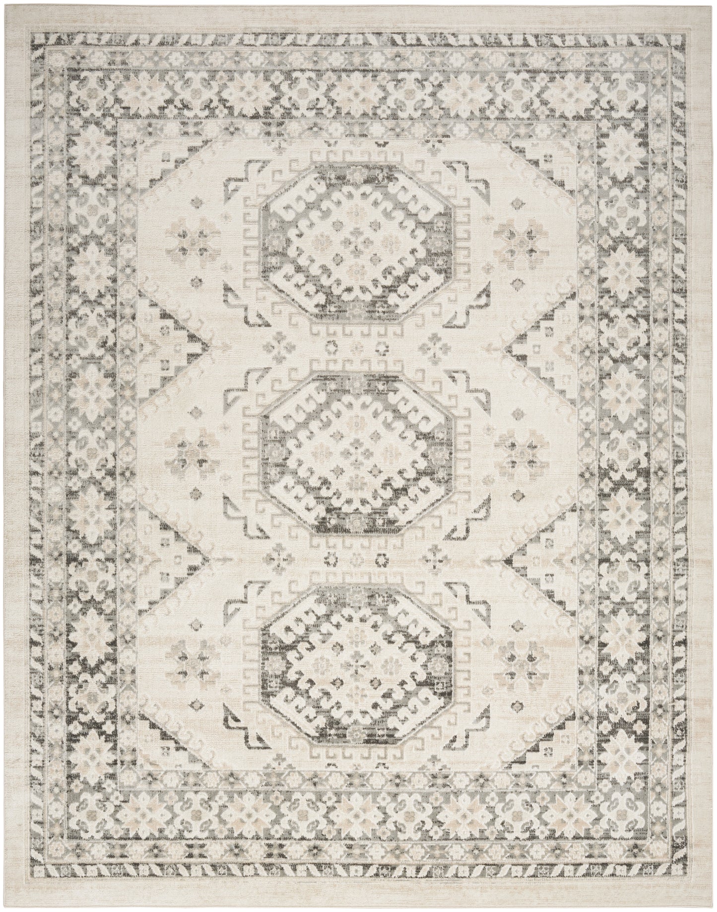 Neutral ivory and gray oriental area rug with three hexagonal medallions and ornate floral border.