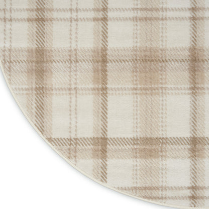 Round beige plaid rug in cream and tan tones; soft woven texture with curved edge.
