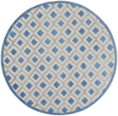 Round area rug with light gray background, blue diamond lattice pattern, and blue border.