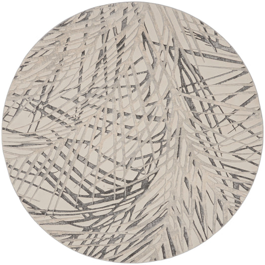 Round rug with abstract gray palm-leaf pattern on beige.