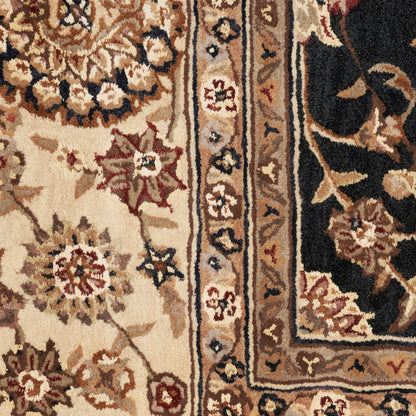 Traditional Persian-style rug close-up: cream field with red and blue floral motifs, tan border and dark outer border.