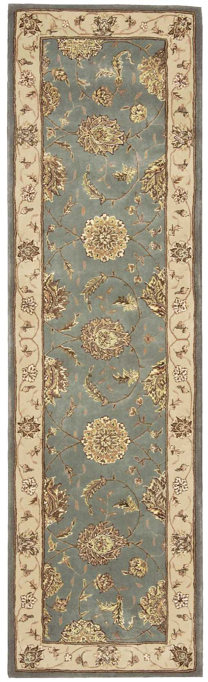 Traditional Persian-style runner rug, blue field with gold floral medallions, beige border and brown trim.