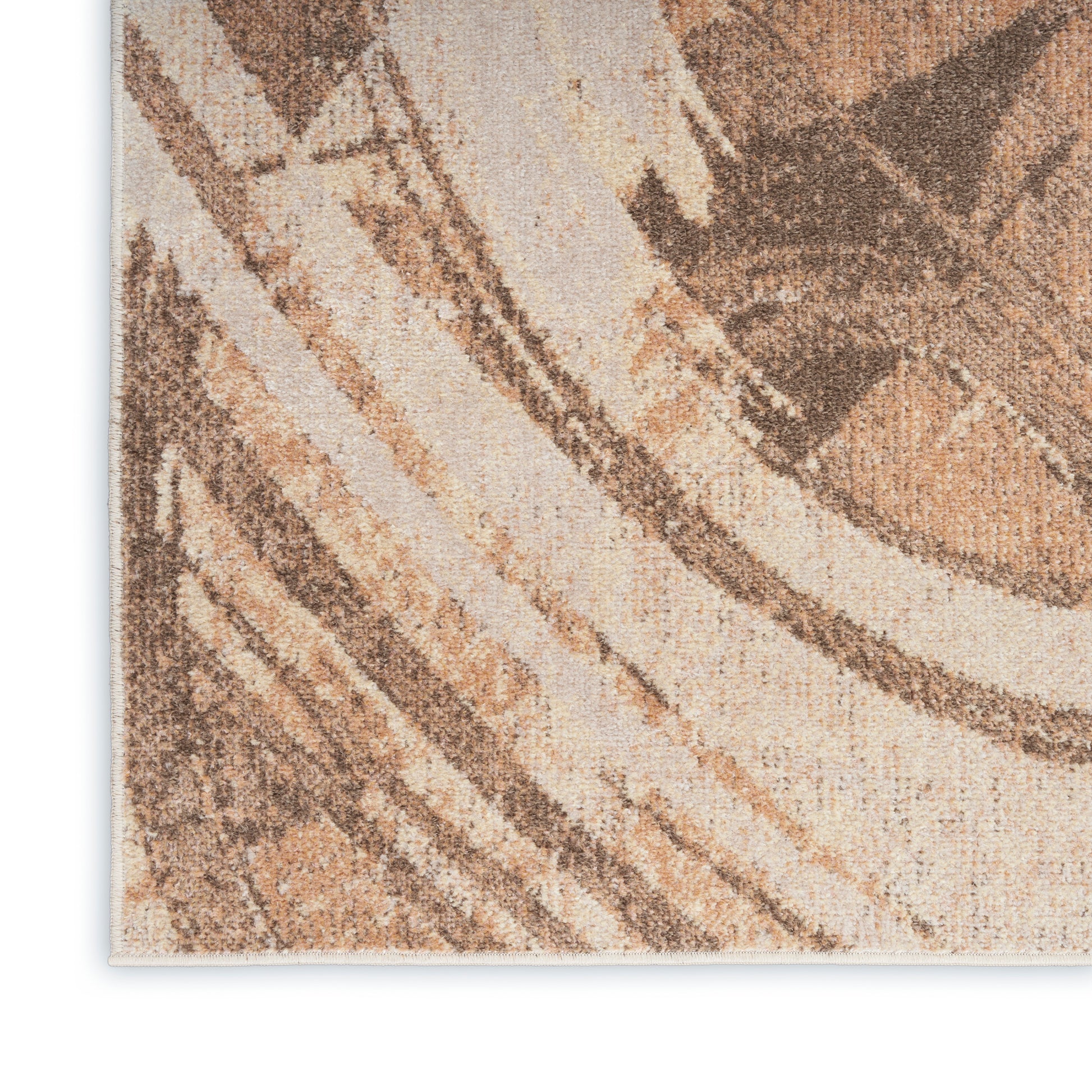 Close-up of beige and brown abstract-patterned rug with a textured woven pile.