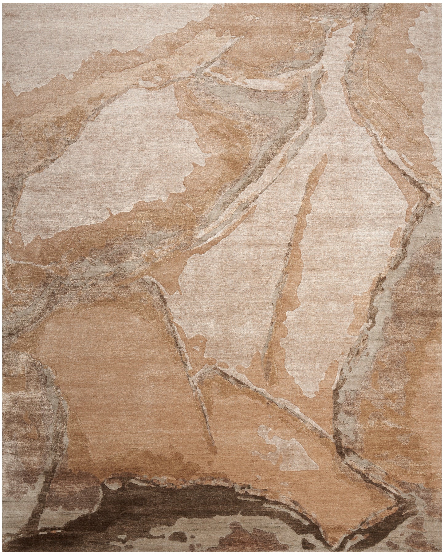 Abstract beige-brown area rug with stone-like shapes in taupe, cream, and tan; plush, modern decor.