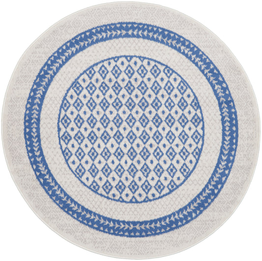 Round white ceramic plate with a blue geometric lattice center and blue patterned rings; decorative dinner plate.