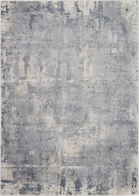 Rectangular rustic area rug in blue-gray with beige distressed abstract pattern, soft vintage look, 6' x 9'.