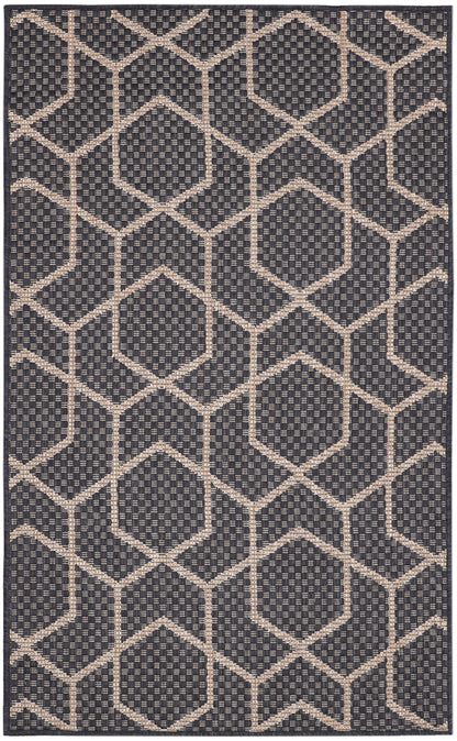 Flatwoven navy rug with beige diamond lattice pattern; geometric, modern decor for living room or entry.