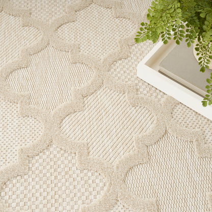 Beige woven area rug with raised geometric lattice pattern; neutral textured floor decor for living rooms.