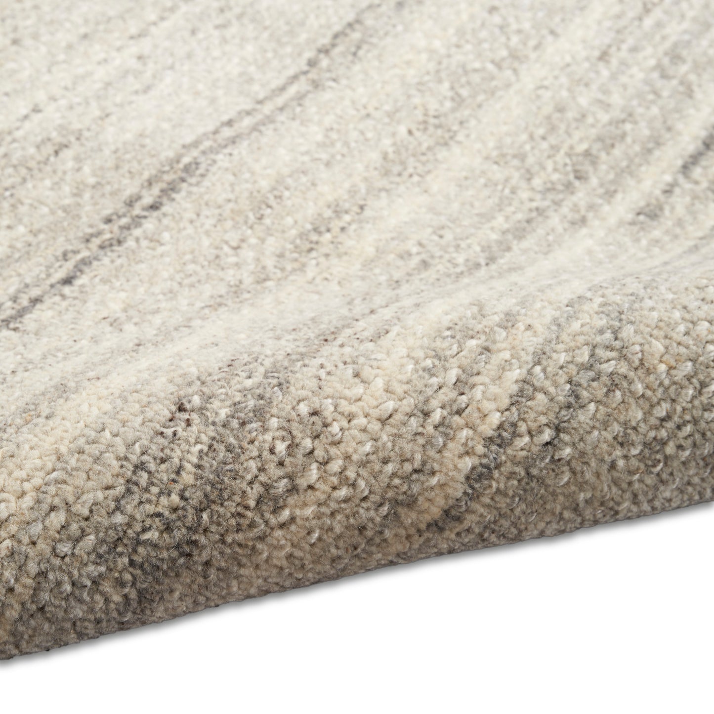 Cream and beige striped tufted area rug with soft plush pile for modern neutral decor.