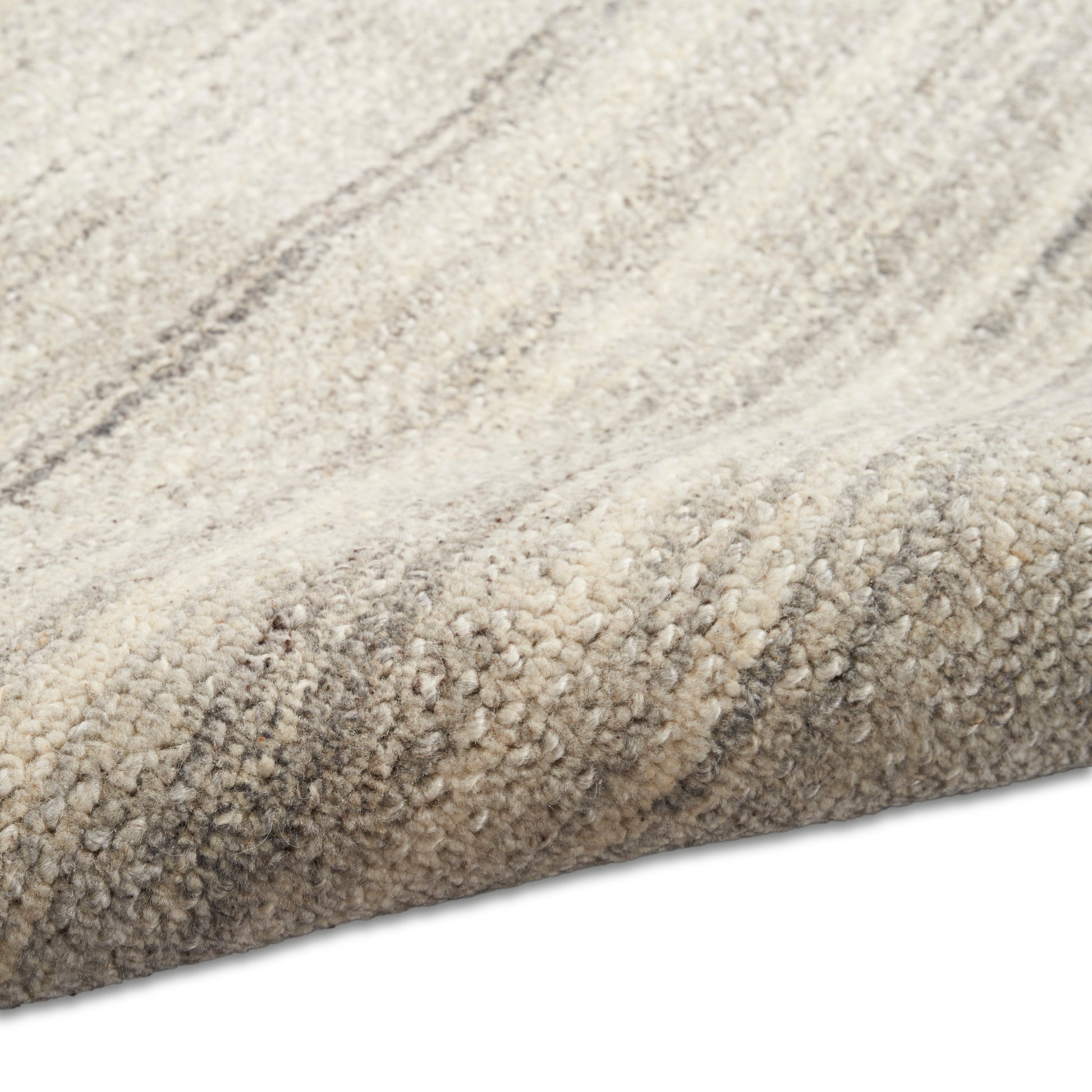 Cream and beige striped tufted area rug with soft plush pile for modern neutral decor.