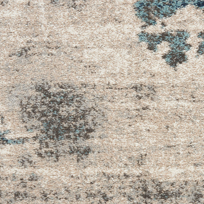 Beige distressed runner rug with dark blue and gray abstract floral pattern and soft pile.