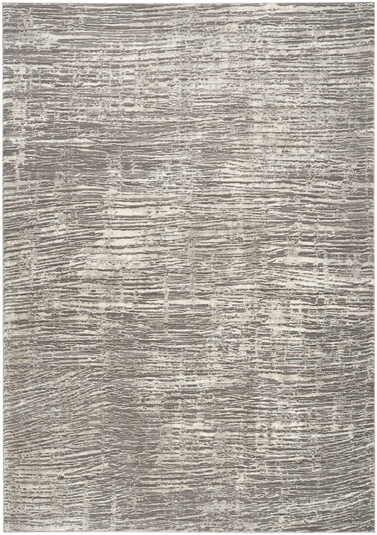 Rectangular gray and beige area rug with abstract linear texture; plush woven pile, modern transitional style.