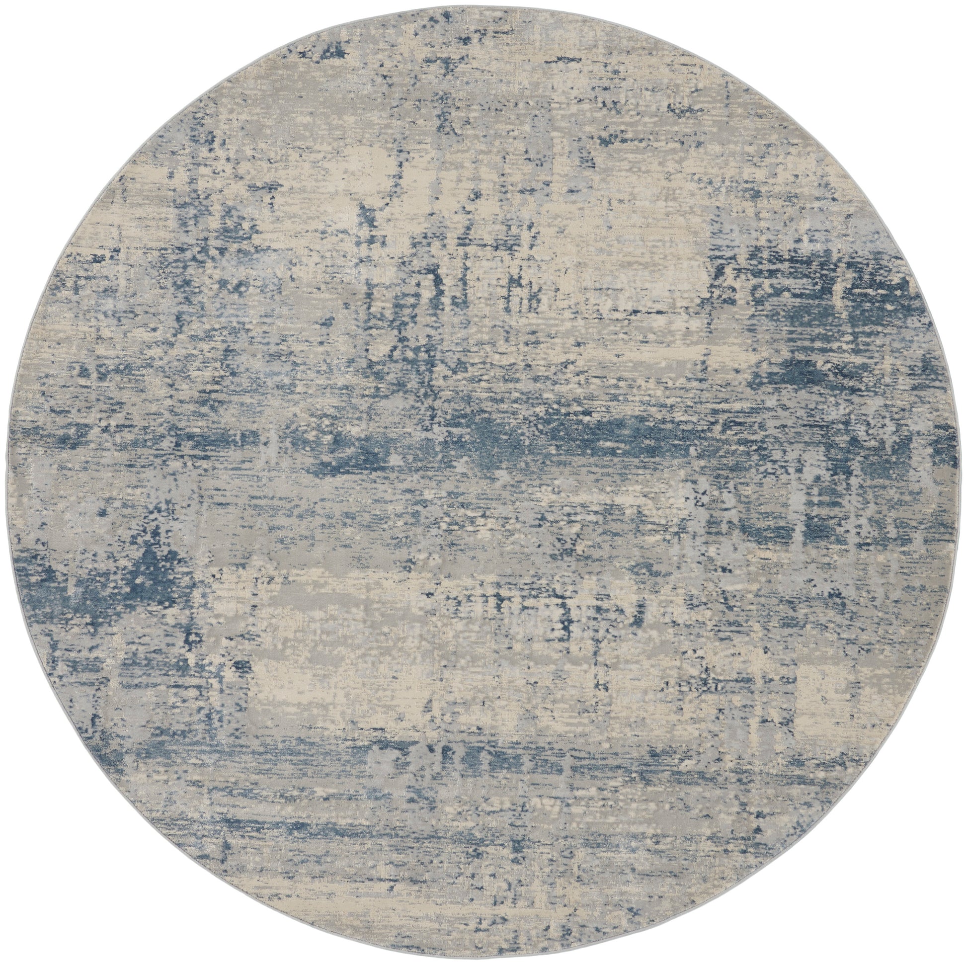 Round area rug in blue and beige with distressed abstract pattern, modern coastal decor.