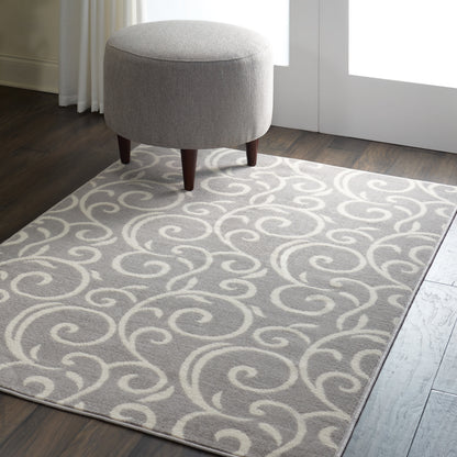 Light gray rug with cream swirls in a modern living space (4' x 6').