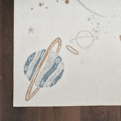 Beige rug with space motif: Saturn-like blue planet with brown rings and small stars.