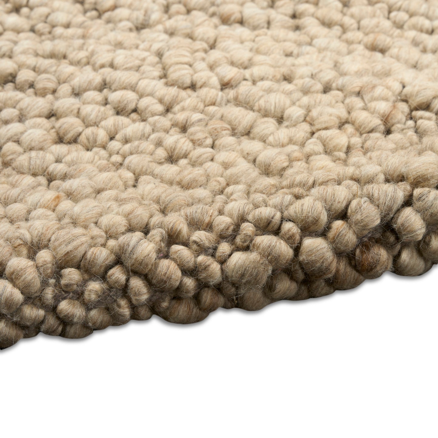 Beige chunky boucle rug with tightly looped wool-like yarn and soft rounded pile.