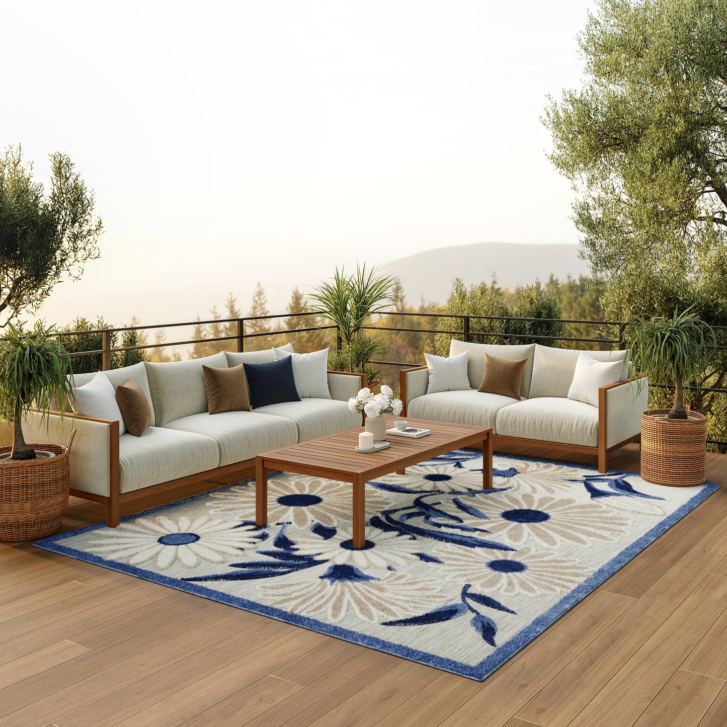 Blue floral rug on the floor, surrounded by potted plants.
