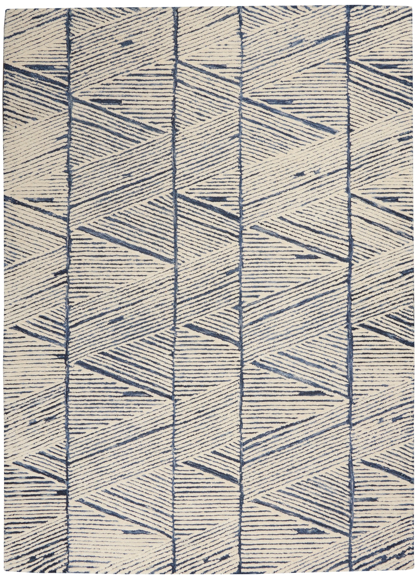 Cream and navy geometric area rug with repeating triangles and chevron shapes in vertical bands.