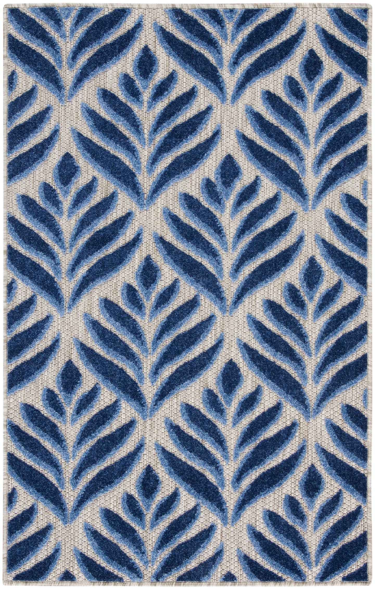 Rectangular tufted rug with navy blue fern-like leaf motifs on a beige woven ground; modern botanical decor for living room.