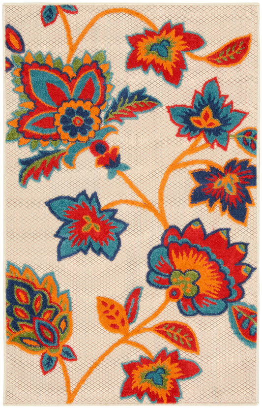 Bold floral area rug with large orange, teal, blue and red flowers on a cream woven background; boho style.