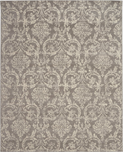 Taupe-gray rug with ivory damask floral scroll pattern; traditional woven style for living room decor.
