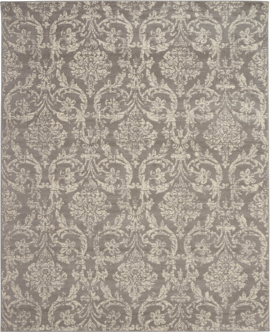 Taupe-gray rug with ivory damask floral scroll pattern; traditional woven style for living room decor.