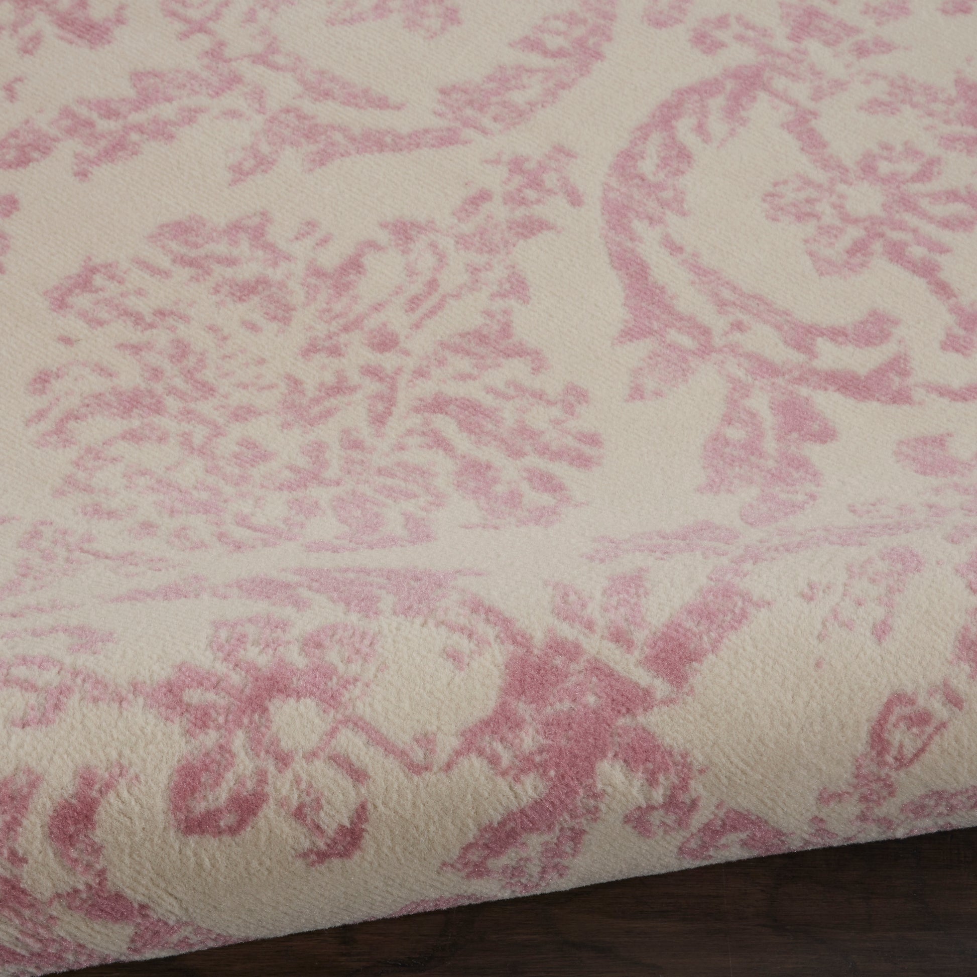 Ivory round rug, 5 ft diameter, featuring a pink damask floral pattern and soft jacquard texture.