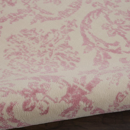 Ivory round rug, 5 ft diameter, featuring a pink damask floral pattern and soft jacquard texture.