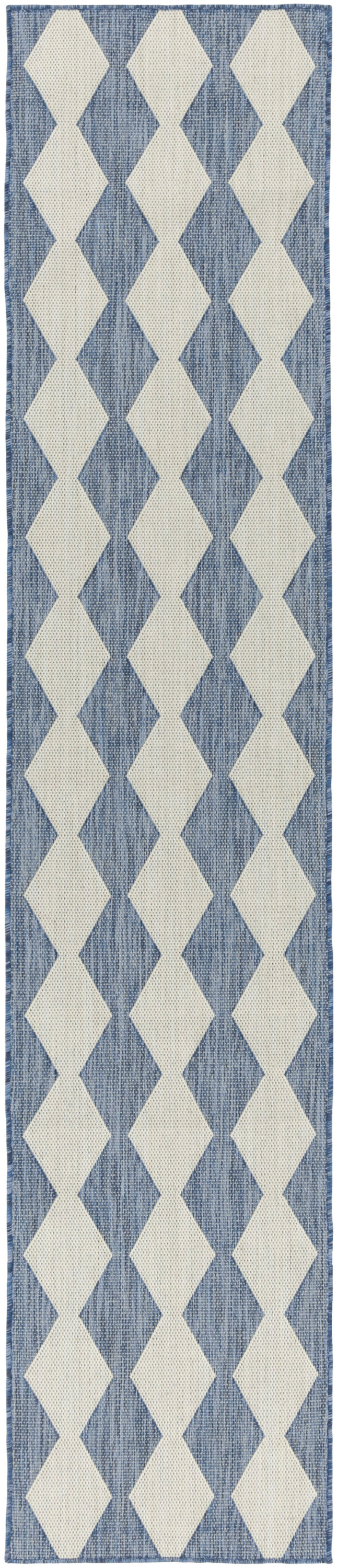 Blue woven runner rug with cream diamond pattern; geometric, hallway decor.