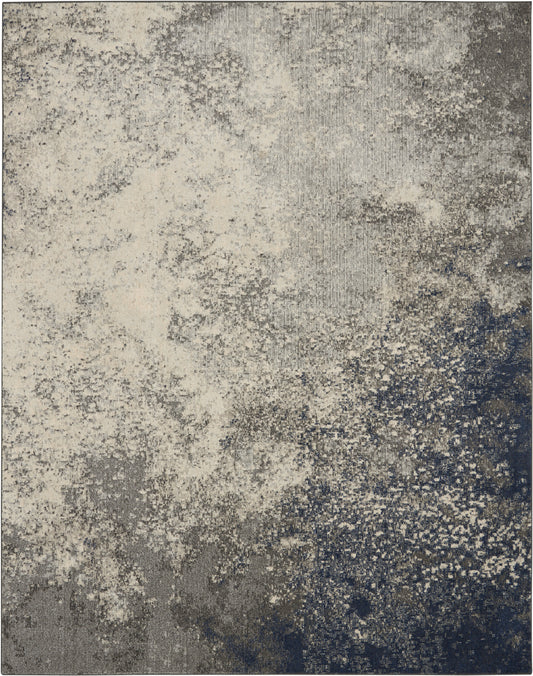 Abstract textured area rug in cream, gray and navy with speckled gradient; soft pile for modern decor.