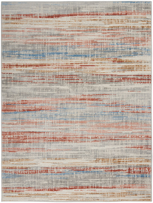 Abstract area rug with faded red, blue and orange horizontal stripes on a light gray-beige background.