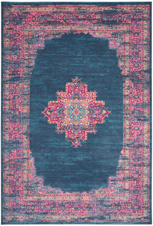 Teal distressed oriental rug with vibrant pink border and a colorful central medallion.